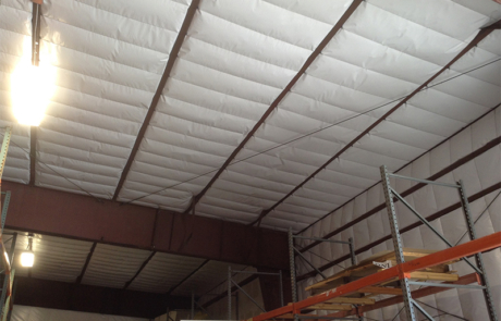 Image showing a large warehouse building after the installation of new insulation in central New Mexico
