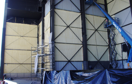 Large warehouse building in the process of having spray foam insulation applied in central New Mexico