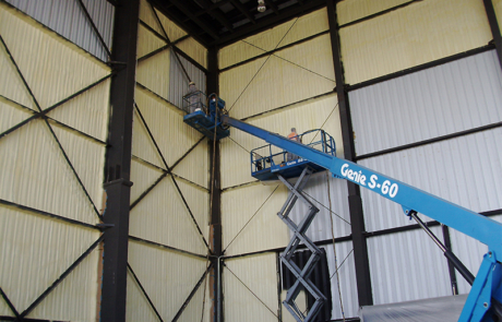 Large warehouse building in the process of having spray foam insulation applied in central New Mexico