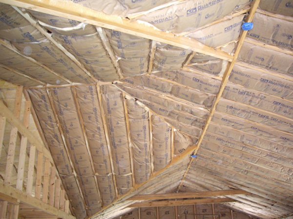Interior roof of a home after having all new fiberglass insulation installed by Garrity Insulation, Inc. in New Mexico