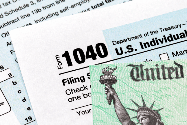 Image of tax papers and a tax return check.