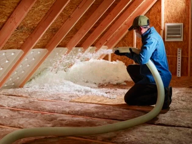 Image showing new attic insulation being installed.