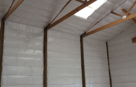 Building insulated with white vinyl finish in central New Mexico