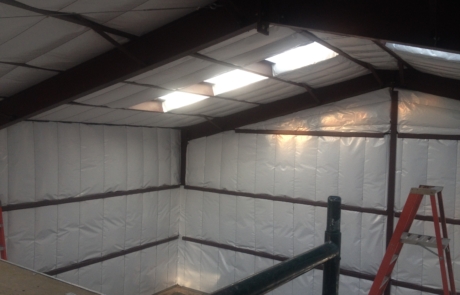 Metal building insulated with white vinyl finish in central New Mexico